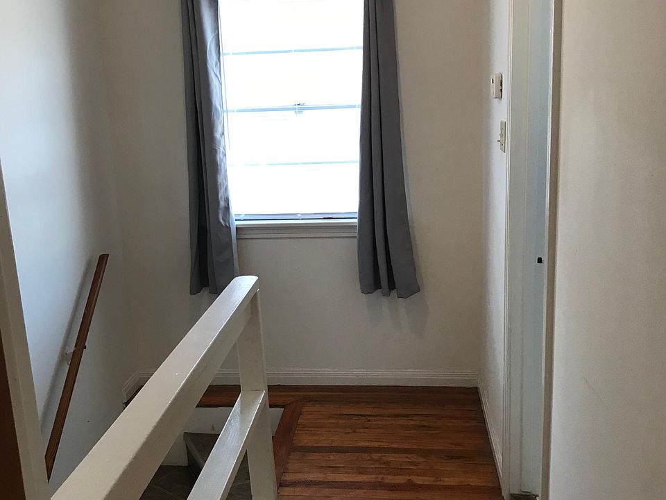 Upstairs hallway. Two ceiling fans, one up and one down. Additional track lighting, too.