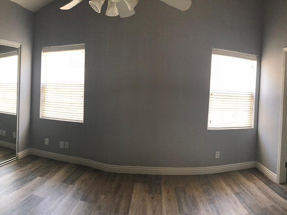 Master bedroom with excellent lighting, ceiling fan and very private.