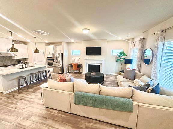 Bar seating for total of 4 plus dinning table seats 8