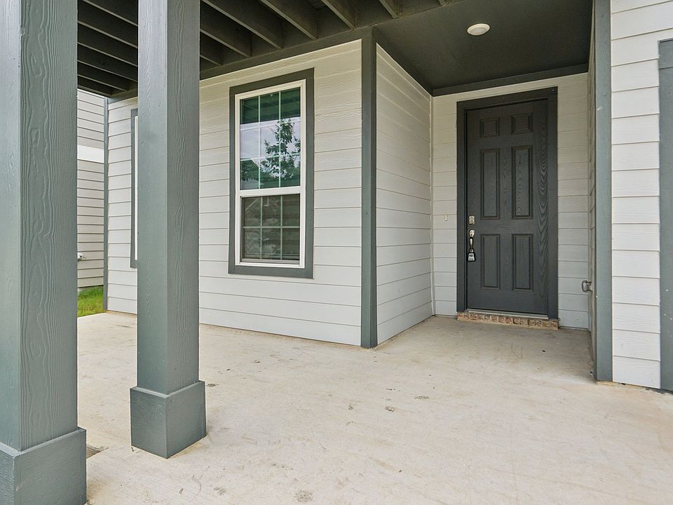 This front porch would be so cute with a few chairs and a plant. Perfect for morning coffee!