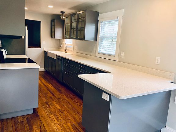 Renovated galley kitchen with lots of storage and counter space.