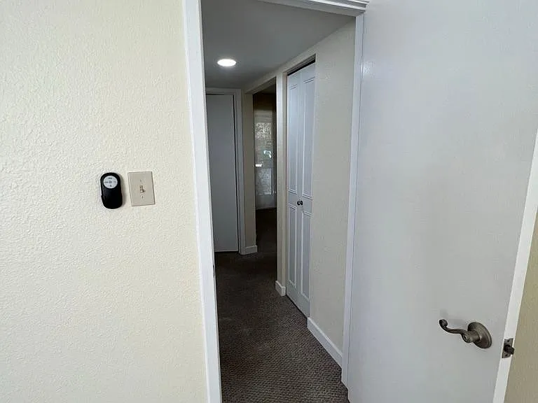 Hall from main bedroom to 2nd; bathroom and bedroom, toward dining and private balcony