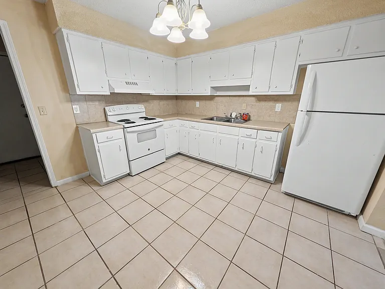 Spacious kitchen with lots of storage. Attached mudroom with backyard access