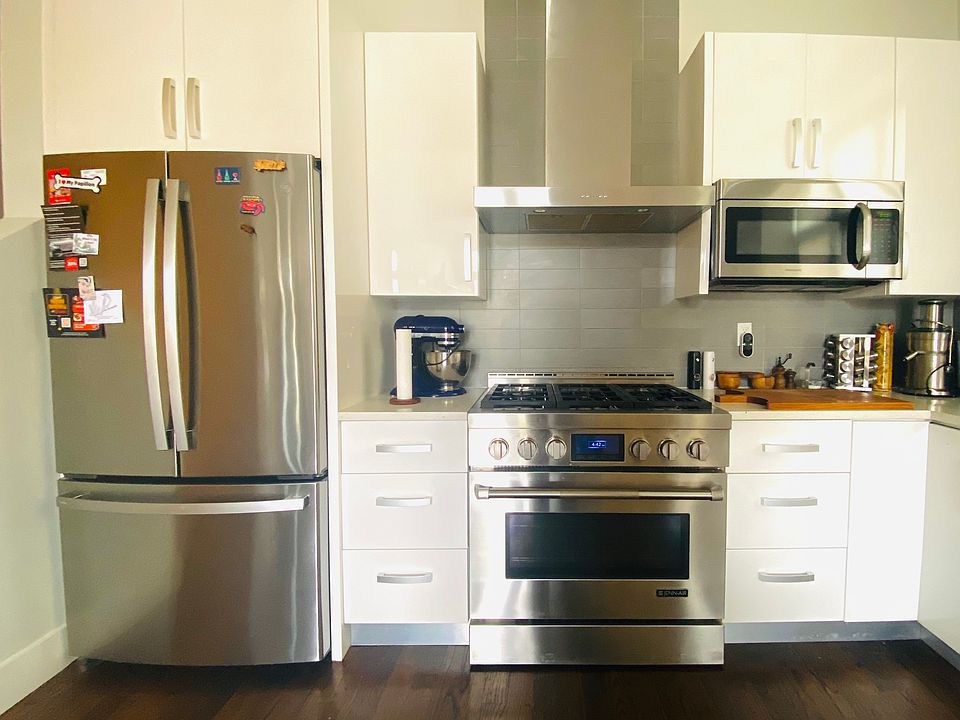 Kitchen with modern appliances and quartz countertops