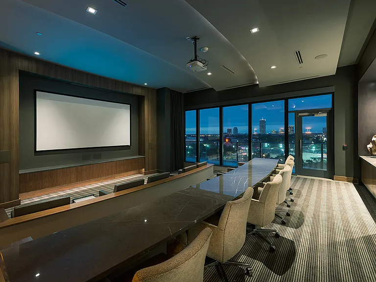 Screening lounge with HD projector and theater style seating