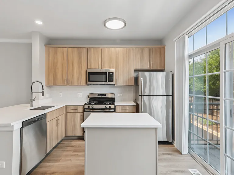 Davey Two Bedroom Townhome - renovated kitchen with stainless steel appliances and rich wood cabinetry