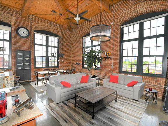 This is the real deal.  Soaring, beamed ceilings, sweeping views of downtown, Midtown, and all the way to Buckhead.  This particular home has few shared walls (save for the floor) because of it's unique location within the building. "H" is at the quiet back of the property just adjacent to the Carroll St gate and steps to the Beltline