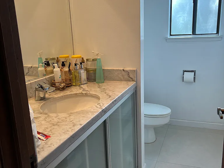 Upstairs toilet and sink on the left.