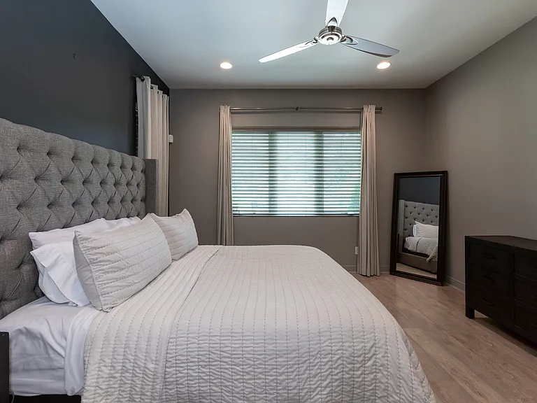 Master bedroom suite overlooks the pool.