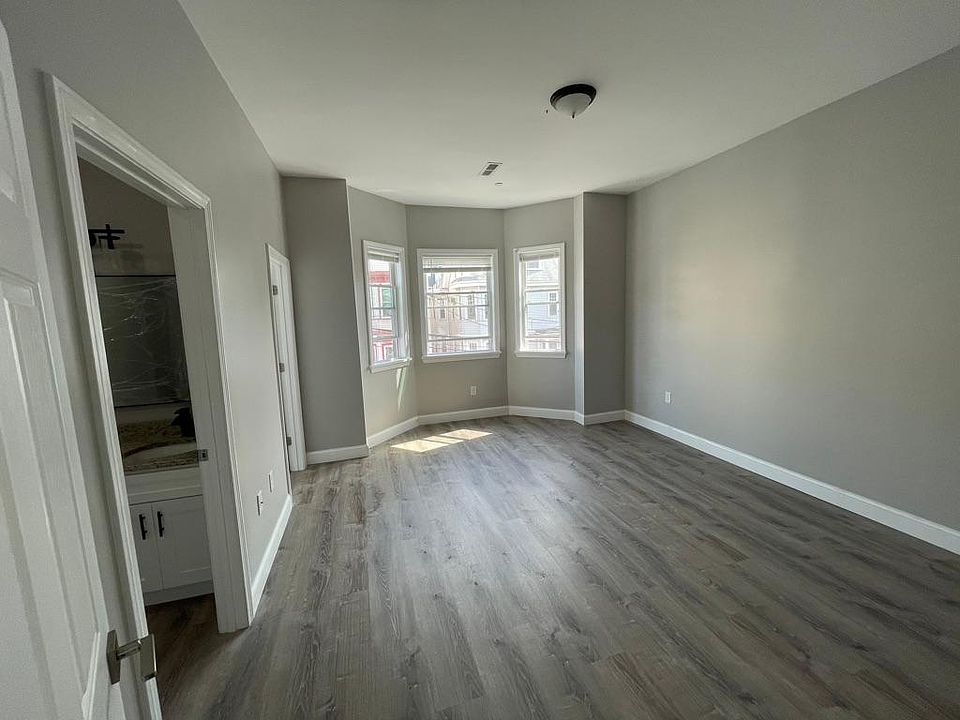 Unit two: master bedroom with double-sink master bathroom and walk-in closet to left.