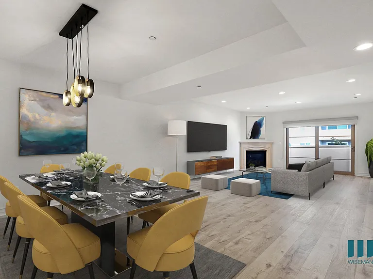 Open-Concept Dining and Living Room Area with Fireplace and Patio
