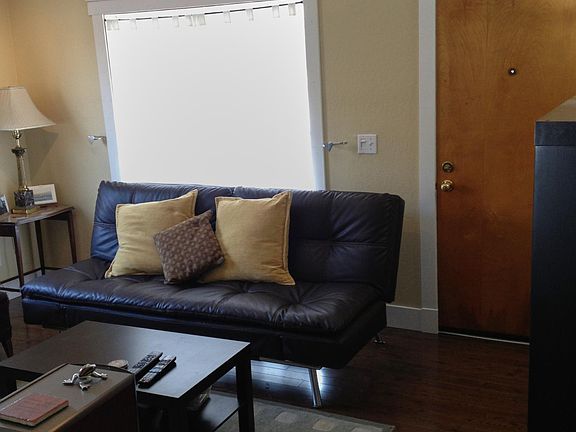 Hardwood floor living room and front door.