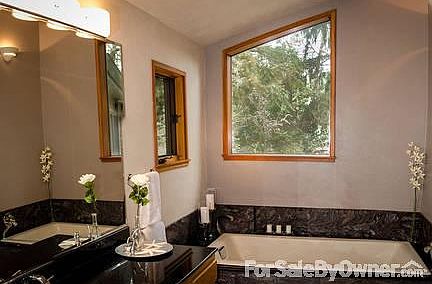 Master Bath
						:
						Soak in the oversize tub while looking out the window.