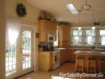 Large Living Room
						:
						Living room with fireplace, built-in bookshelves and crown molding.