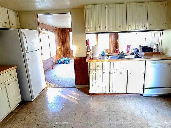 Complete kitchen with stove, dishwasher, garbage disposal, refrigerator and plenty of cabinet space. Enough room for a small kitchen table for dining.