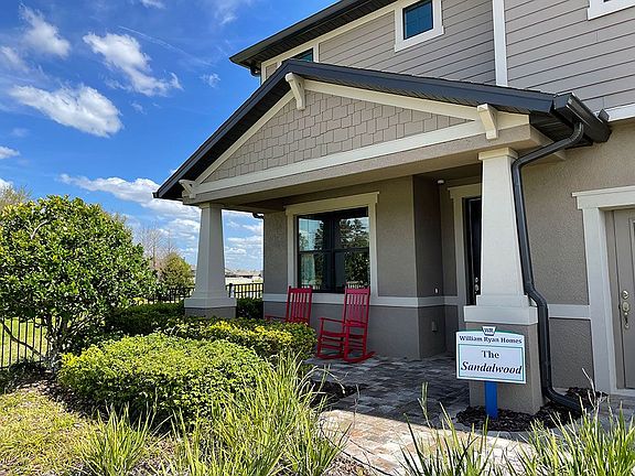 Sandalwood model home Craftsman style welcoming front porch William Ryan Homes Tampa