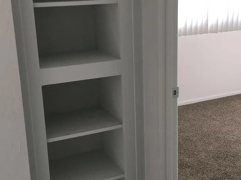 Hall way with shelf space