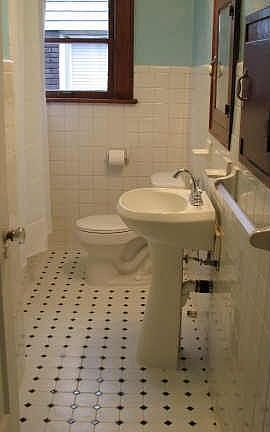 All tile bath, original cabinetry