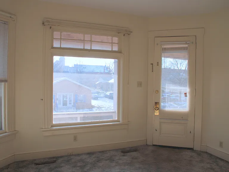Living room picture window and front door.