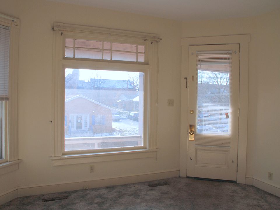 Living room picture window and front door.
