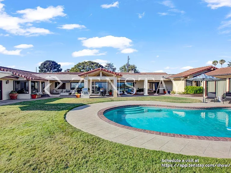 Resort-style circular pool as the centerpiece of the backyard