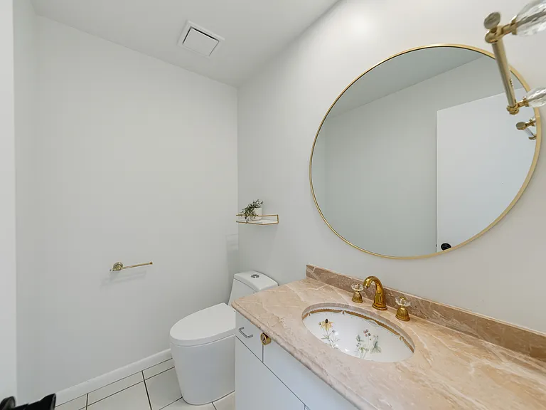A POWDER ROOM ON 1ST FL.-NEW MODERN TOILET AND IMPORTED BASIN