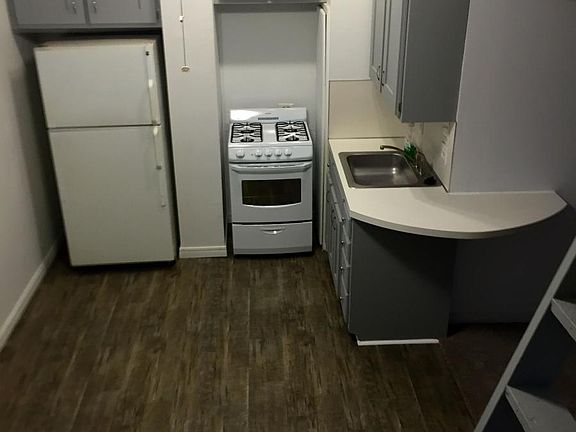 Spacious kitchen with plenty of cabinet space and new floori