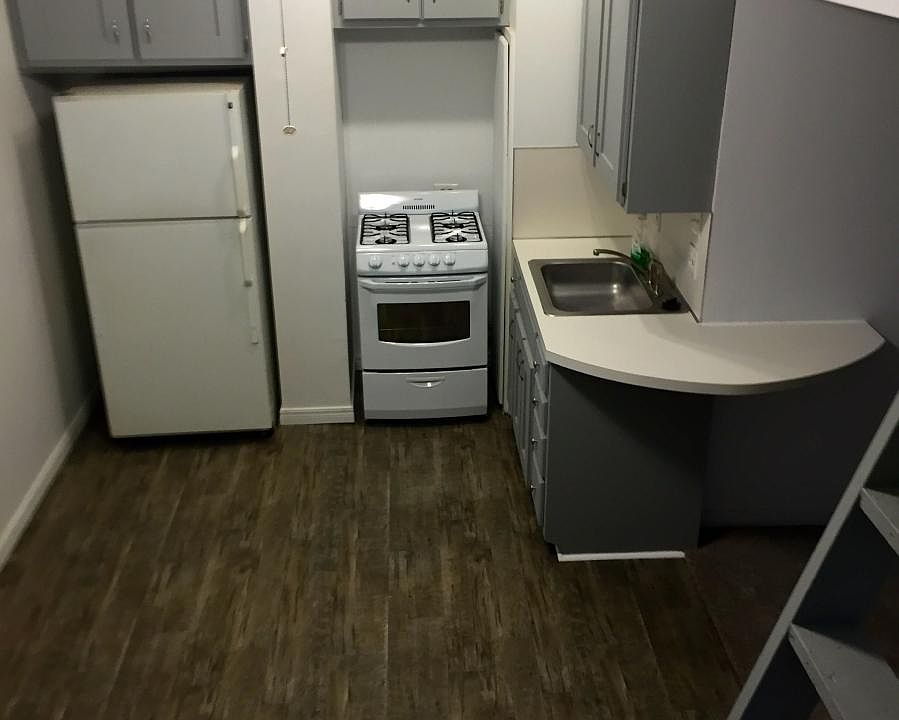 Spacious kitchen with plenty of cabinet space and new floori
