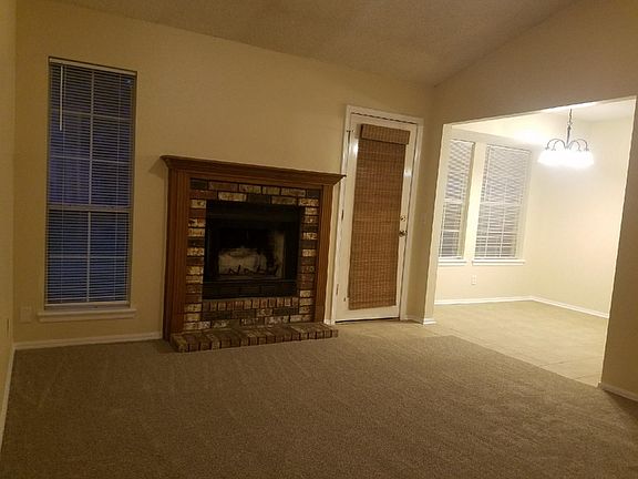 Family Room with vaulted ceiling and fireplace
