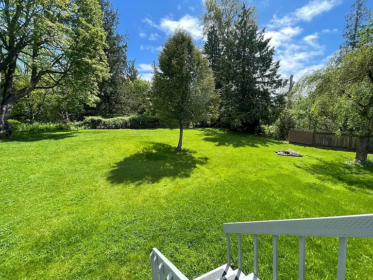 Expansive private backyard with plenty of room for entertaining, gardening, or outdoor recreation