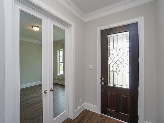 Warm entry. French doors lead to a spacious study!
