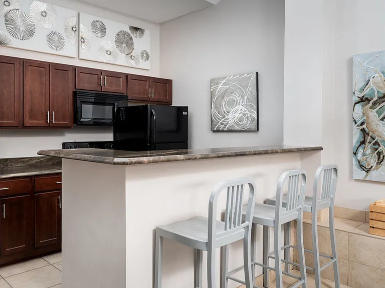 Experience a modern kitchen in Florence, KY, designed for both cooking and entertaining with a functional layout and sleek finishes.