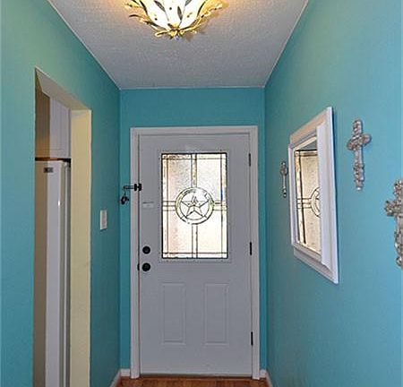 Laminate wood flooring greets you in the entry and extends throughout the home...