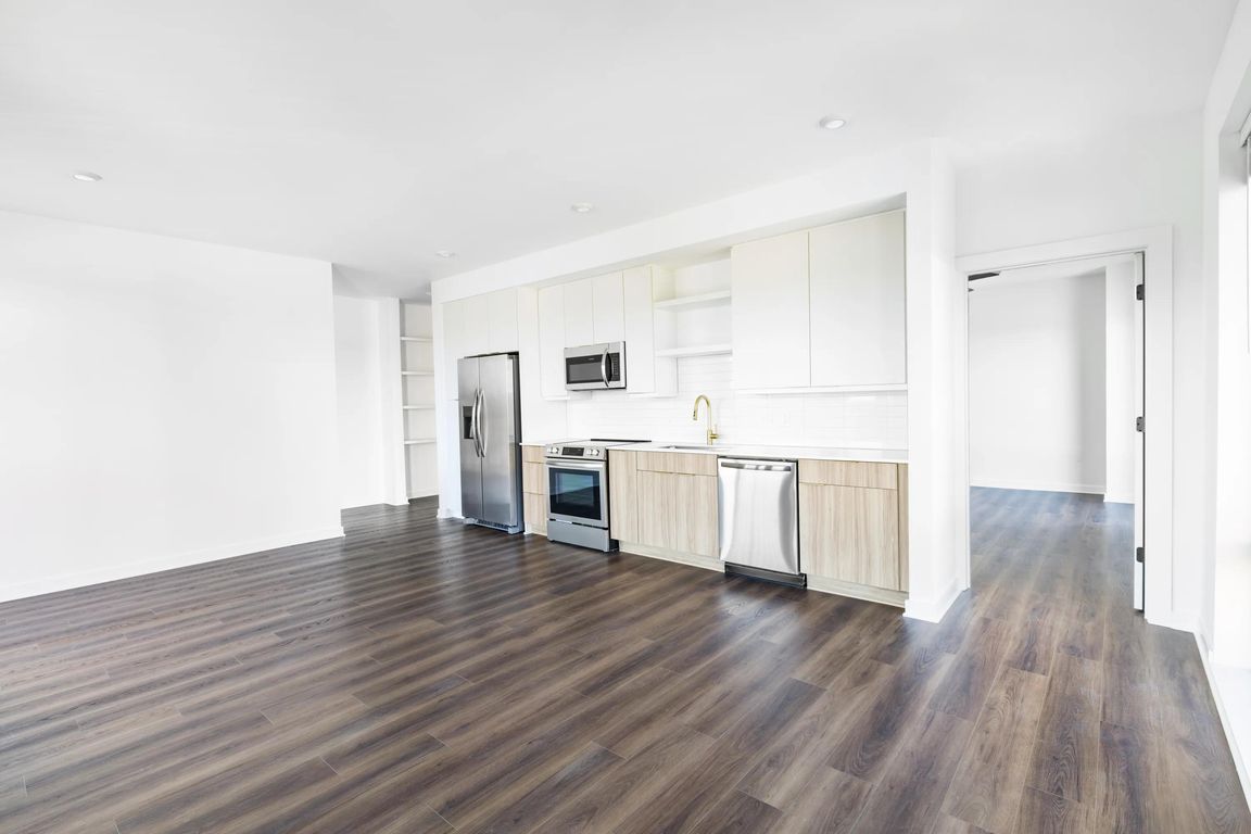 An open, light-filled kitchen anchors this Nashville home at Modera Nations, with clean lines, refined finishes, and space designed for effortless everyday living.