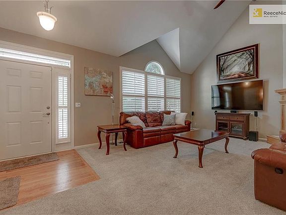 Bright and Open Family Room with Plantation Blinds!
