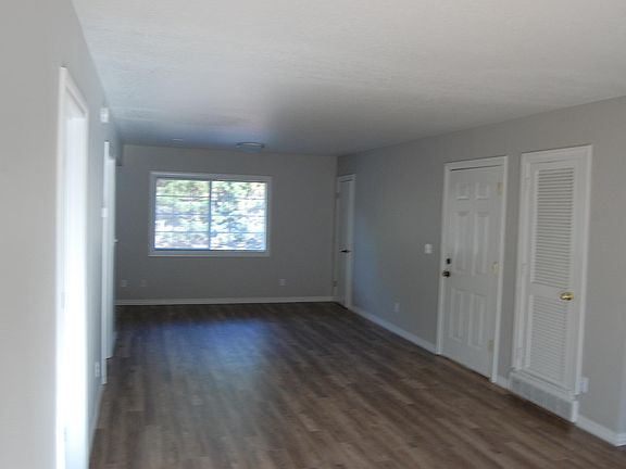 Open main room with newer laminate flooring
