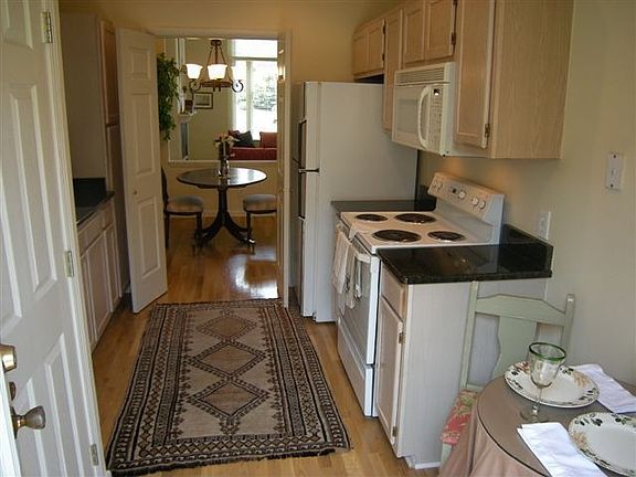  Kitchen with granite countertops, includes appliances 