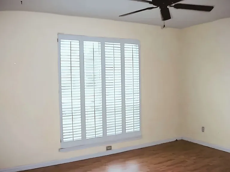 Primary bedroom with ceiling fan