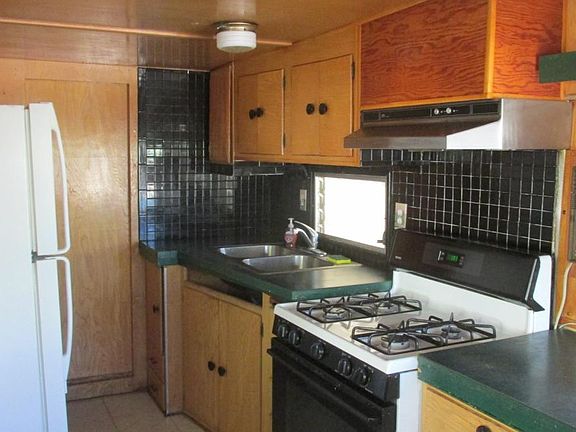 kitchen is trailer, block house built around it