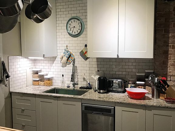 New Kitchen with stainless dishwasher and new refirgerator with ice maker.