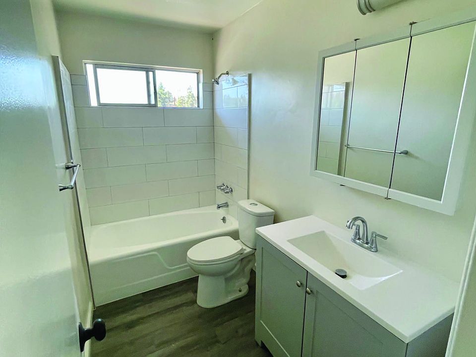 New Vanity, tile, hardwood floor laminate, fresh paint. Clean living.