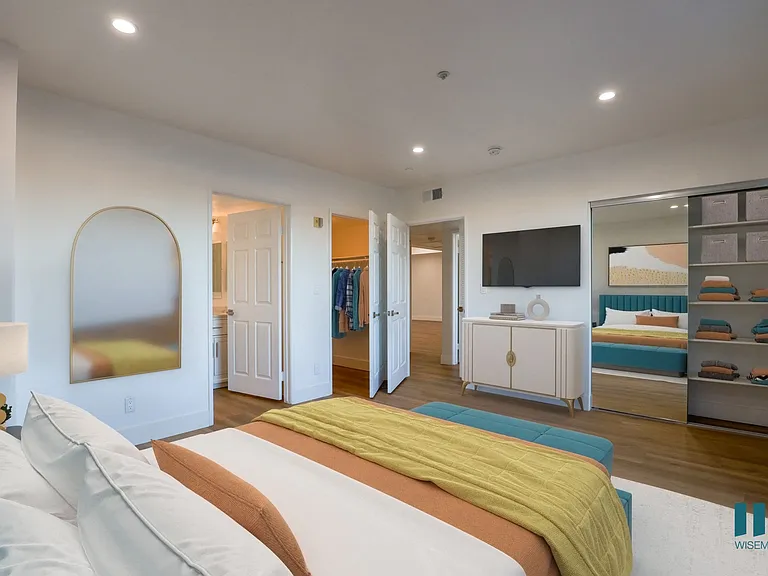 Large-Size Bedroom with Mirrored Closet with Shelving, Vinyl Flooring, and Bathroom