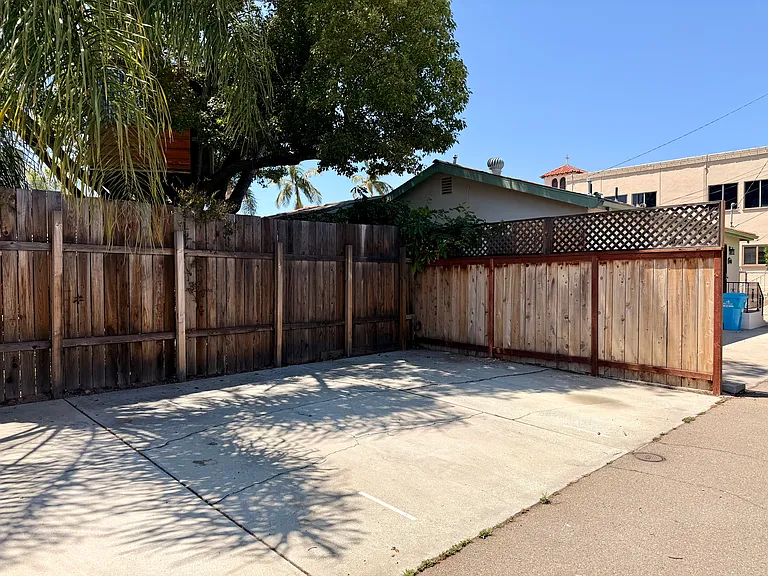 The apartment monthly rent includes one parking space (the middle spot), suitable for a compact to medium sized vehicle.