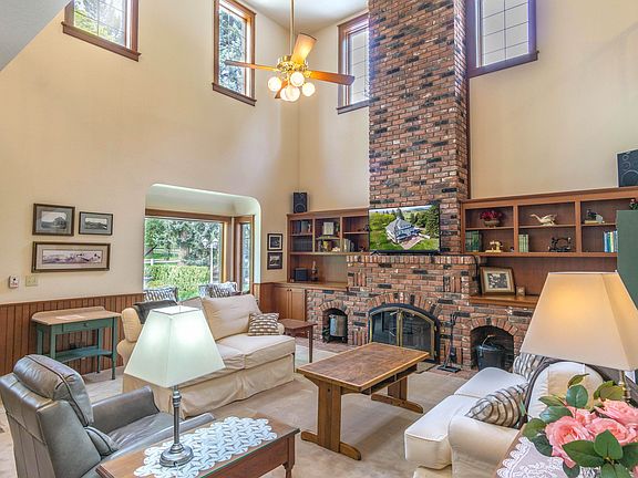 Spacious living room with cozy fireplace welcomes you