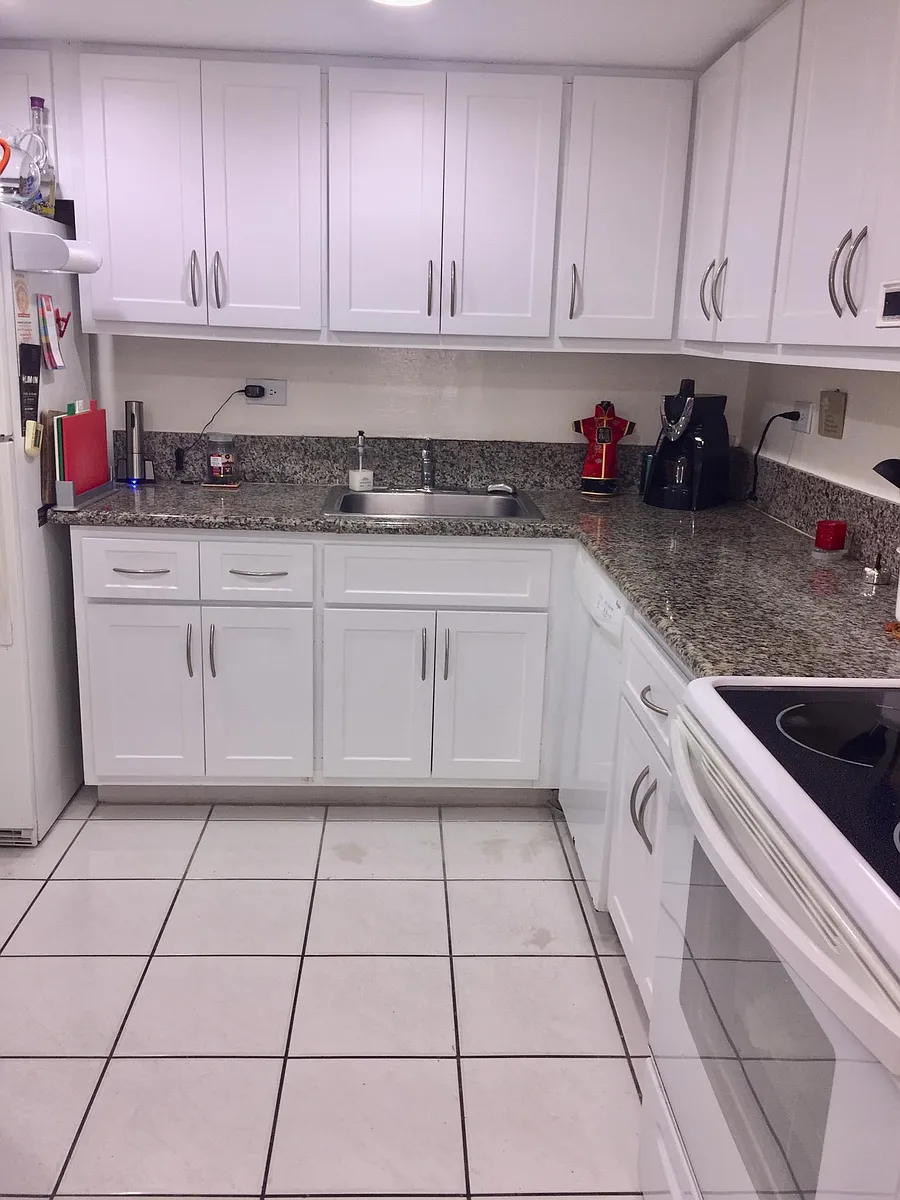 Kitchen: White shaker style cabinets and granite counter tops - 8101 SW 72nd Ave #117W