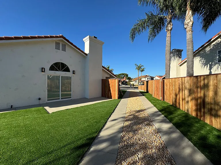 Immaculately landscaped yard with fenced in backyard. Solar panels for your utilities, Brand new roof,