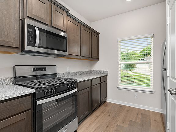 The kitchen of the Driftwood has beautiful wood cabinetry.