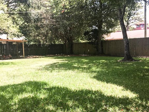 Huge backyard with a double swinging gate giving you access from the alley.