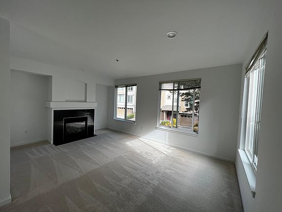 Living room with gas fireplace. Wall mount for tv provided above fireplace