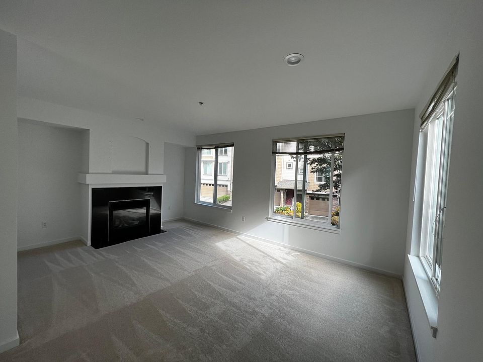 Living room with gas fireplace. Wall mount for tv provided above fireplace